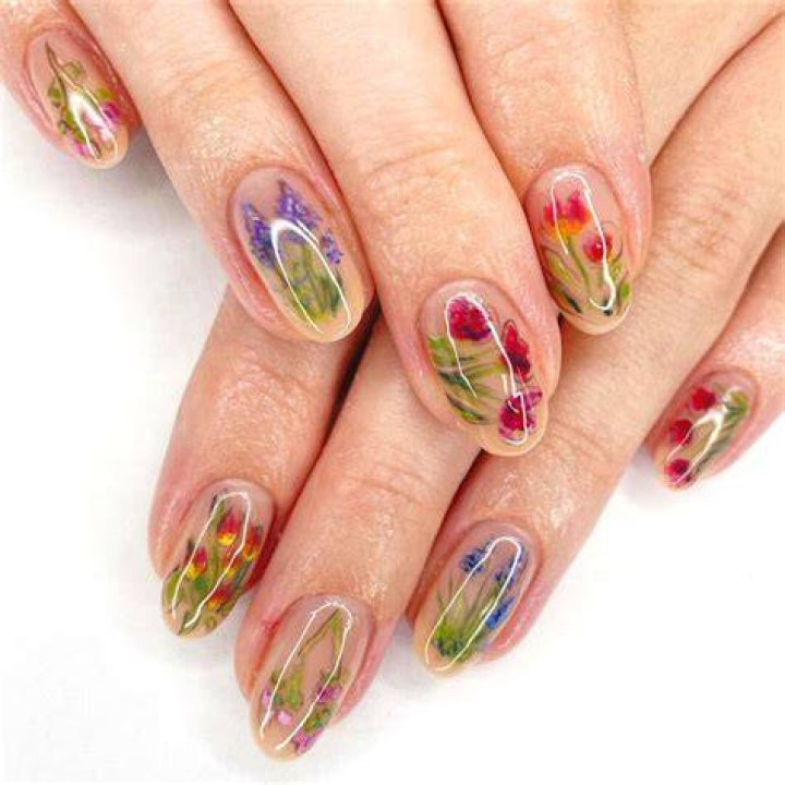 Botanical pressed floral nail art with dried flowers encapsulated in gel