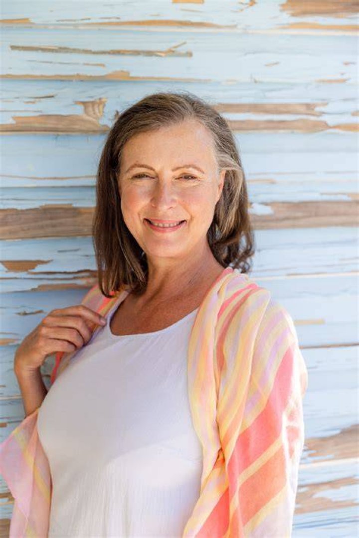 Senior woman choosing authentic photos for dating profile